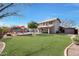 Large backyard with a grassy lawn, pool, and patio at 11553 N 76Th Dr, Peoria, AZ 85345