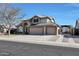 Two-story house with three-car garage and solar panels at 11553 N 76Th Dr, Peoria, AZ 85345