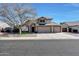 Two-story house with three-car garage and solar panels at 11553 N 76Th Dr, Peoria, AZ 85345