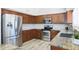 Kitchen with stainless steel appliances and wood cabinets at 11553 N 76Th Dr, Peoria, AZ 85345