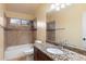 Bathroom with granite countertop, tile shower, and bathtub at 1157 E Liberty Ln, Gilbert, AZ 85296