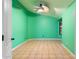 Green bedroom with tile flooring and ceiling fan at 1157 E Liberty Ln, Gilbert, AZ 85296