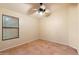 Bright bedroom with tile flooring and ceiling fan at 1157 E Liberty Ln, Gilbert, AZ 85296