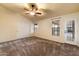 Main bedroom with carpet flooring, double closets, and access to backyard at 1157 E Liberty Ln, Gilbert, AZ 85296