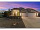 Beautiful two-story house with a two-car garage and desert landscaping at 1157 E Liberty Ln, Gilbert, AZ 85296