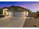 Two-story home with a two-car garage and well-maintained landscaping at 1157 E Liberty Ln, Gilbert, AZ 85296