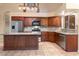 Spacious kitchen with island, granite countertops, and stainless steel appliances at 1157 E Liberty Ln, Gilbert, AZ 85296