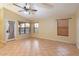 Living room features tile flooring and ceiling fan at 1157 E Liberty Ln, Gilbert, AZ 85296