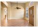 Bright and airy living room with tile floors and a ceiling fan at 1157 E Liberty Ln, Gilbert, AZ 85296