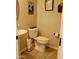 Powder room with pedestal sink and toilet at 12075 E Chevelon Trl, Gold Canyon, AZ 85118