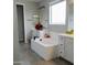 Primary bathroom with a soaking tub, double vanity, and tile flooring at 12075 E Chevelon Trl, Gold Canyon, AZ 85118