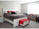 Main bedroom with a king-size bed and red and gray accents at 12075 E Chevelon Trl, Gold Canyon, AZ 85118