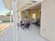 Inviting patio area with a pergola and outdoor seating, ideal for relaxing and enjoying the beautiful weather at 12075 E Chevelon Trl, Gold Canyon, AZ 85118