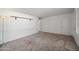 Simple bedroom with neutral walls and carpeted floors at 1231 E Vine Ave, Mesa, AZ 85204