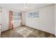 Bedroom with ceiling fan and neutral decor at 1231 E Vine Ave, Mesa, AZ 85204