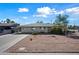 Charming ranch home features a neat front yard and a long driveway at 1231 E Vine Ave, Mesa, AZ 85204