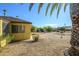 Backyard with gravel, plants, and a view of the house at 12323 W Tigerseye Dr, Sun City West, AZ 85375