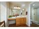 Clean bathroom with single sink vanity and walk-in shower at 12323 W Tigerseye Dr, Sun City West, AZ 85375