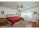 Spacious Primary bedroom with a king-size bed and plenty of natural light at 12323 W Tigerseye Dr, Sun City West, AZ 85375