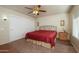 Comfortable guest bedroom featuring a queen-size bed and ample closet space at 12323 W Tigerseye Dr, Sun City West, AZ 85375