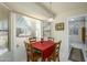 Bright breakfast nook with a table and chairs, overlooking the backyard at 12323 W Tigerseye Dr, Sun City West, AZ 85375