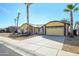 House exterior showcasing desert landscaping and a two-car garage at 12323 W Tigerseye Dr, Sun City West, AZ 85375