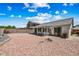 Spacious backyard with gravel and patio at 12930 W Pershing St, El Mirage, AZ 85335