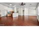 Open concept living room and kitchen area with wood flooring at 12930 W Pershing St, El Mirage, AZ 85335