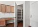 Walk-in pantry with ample shelving for storage at 12930 W Pershing St, El Mirage, AZ 85335