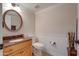 Powder room with wood vanity and granite countertop at 1397 E Cheyenne St, Gilbert, AZ 85296