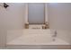 Bathroom with a built in tub and window at 1397 E Cheyenne St, Gilbert, AZ 85296