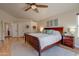 Bright bedroom with a king-size bed and hardwood floors at 1397 E Cheyenne St, Gilbert, AZ 85296