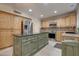 Spacious kitchen with an island and wood cabinets at 1397 E Cheyenne St, Gilbert, AZ 85296