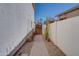 Landscaped side yard with a pathway and cacti at 1397 E Cheyenne St, Gilbert, AZ 85296