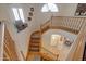 Elegant wooden staircase leading to the lower level at 1397 E Cheyenne St, Gilbert, AZ 85296