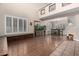 Open dining area adjacent to living room with hardwood floors at 1540 W Orchid Ln, Chandler, AZ 85224