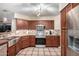 Modern kitchen with stainless steel appliances and wood cabinets at 1540 W Orchid Ln, Chandler, AZ 85224