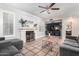 Cozy living room with fireplace and built-in shelving at 1540 W Orchid Ln, Chandler, AZ 85224