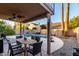 Covered patio with outdoor dining and pool views at 1540 W Orchid Ln, Chandler, AZ 85224