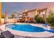 Inviting pool area with a covered patio, grill, outdoor dining, and second story balcony at 1540 W Orchid Ln, Chandler, AZ 85224