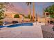 Backyard pool area with landscaped features and ambient lighting for evening enjoyment at 1540 W Orchid Ln, Chandler, AZ 85224