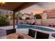 Enjoy dining al fresco by the pool; covered patio at 1540 W Orchid Ln, Chandler, AZ 85224