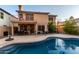 Relaxing backyard with a kidney-shaped pool, patio furniture, and basketball court at 1540 W Orchid Ln, Chandler, AZ 85224