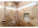 Large walk-in shower with tile surround and built-in shelving at 1540 W Orchid Ln, Chandler, AZ 85224