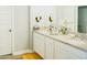 Double vanity bathroom with granite countertops at 15541 S 181St Ln, Goodyear, AZ 85338