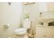 Clean bathroom with white pedestal sink and toilet at 15541 S 181St Ln, Goodyear, AZ 85338