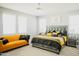 Main bedroom with king-size bed, yellow accents, and en-suite bathroom at 15541 S 181St Ln, Goodyear, AZ 85338