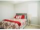 Cozy bedroom featuring a comfortable bed and red bedding at 15541 S 181St Ln, Goodyear, AZ 85338