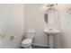 Simple, clean bathroom with pedestal sink and toilet at 16614 N 51St St, Scottsdale, AZ 85254