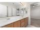 Double vanity bathroom with a large mirror and ample counter space at 16614 N 51St St, Scottsdale, AZ 85254